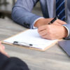 Legal recruiter signing a document