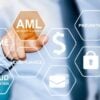 hand touching button with AML anti money laundering symbol