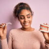Young woman with braces and clear aligners