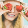 Young woman with fresh strawberries