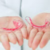 Dentist holding Retainer, Orthodontics