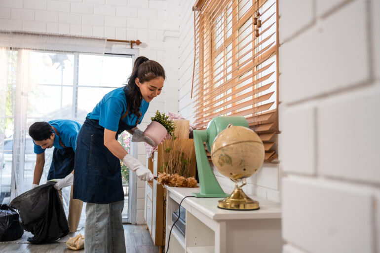 young man and woman cleaning service worker work in living room.
