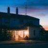 Charming house at sunset in suburban setting